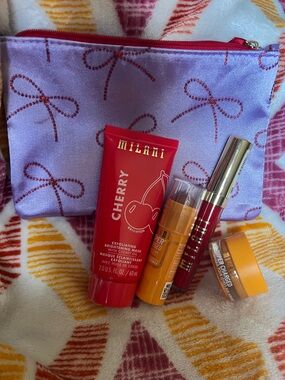 Milani Set w/ lip scrub, cheek n lip stick, face mask, liquid lip all in bag.